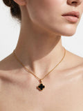Golden chain necklace with black clover pendant worn by model - Avenzra Black Clover Jewellery Set