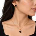 Model wearing black clover gold necklace and stud earrings - Avenzra Black Clover Jewellery Set