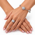 Model hands wearing silver starburst bangle and ring set - Avenzra Starburst Bangle & Ring Set
