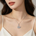 Woman wearing silver crystal swan pendant necklace - Avenzra Swan Pendant Necklace
