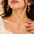 Model wearing pink tulip pendant necklace and drop earrings - Avenzra Tulip Jewellery Set