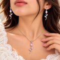 Model wearing silver and pink stone tulip necklace and drop earrings - Avenzra Tulip Jewellery Set
