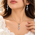 Model wearing silver clear crystal tulip necklace and drop earrings - Avenzra Tulip Jewellery Set