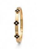 Side view of gold bangle with black clover charms and stones - Avenzra Black Clover Gold Bangle